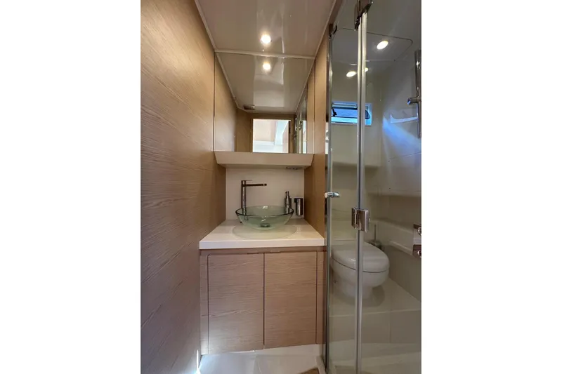  Yacht Photos Pics Luxurious bathroom in 2024 Solaris Power 40 Open yacht with glass sink and shower.