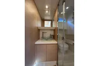 Luxurious bathroom in 2024 Solaris Power 40 Open yacht with glass sink and shower.