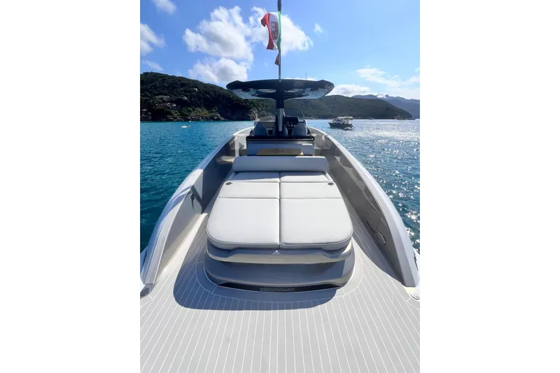  Yacht Photos Pics 2024 Solaris Power 40 Open yacht on serene blue waters, showcasing sleek design and luxury.