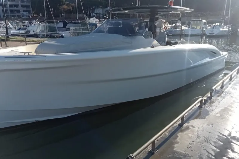  Yacht Photos Pics 2024 Solaris Power 40 Open yacht docked in a marina, showcasing sleek design.