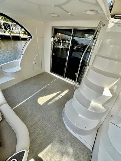 Dolce Far Niente Yacht Photos Pics 2013 Meridian 441 Sedan yacht interior with stairs and waterfront view.