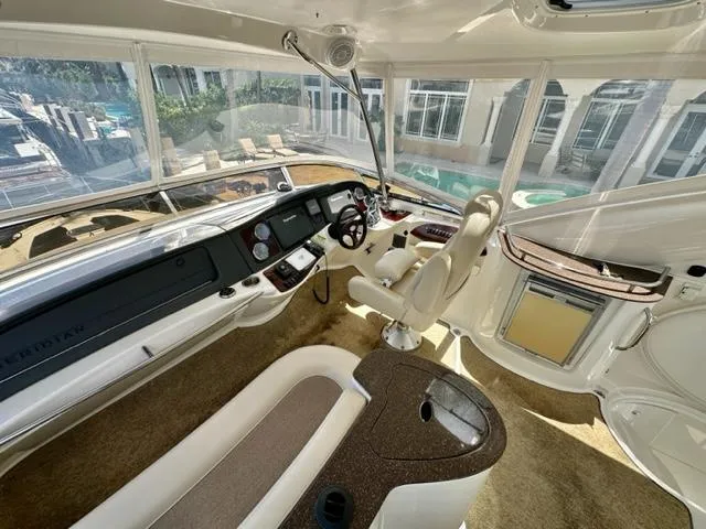 Dolce Far Niente Yacht Photos Pics 2013 Meridian 441 Sedan yacht interior with helm station and panoramic windows.