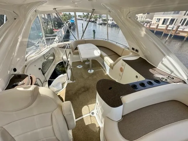 Dolce Far Niente Yacht Photos Pics Luxurious interior of 2013 Meridian 441 Sedan yacht with waterfront view.