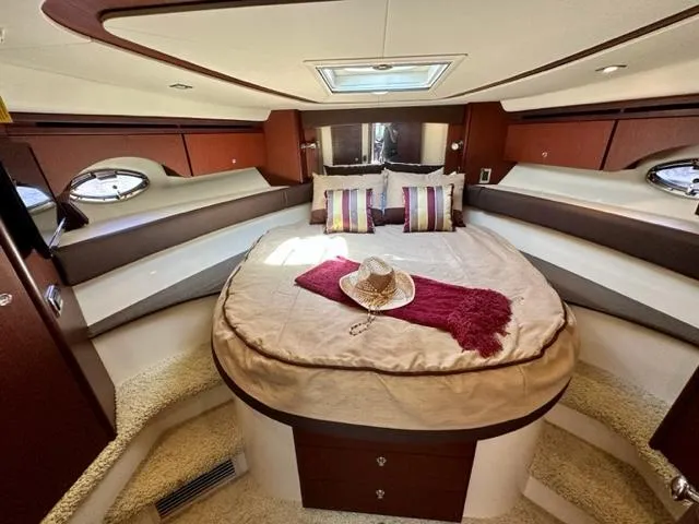 Dolce Far Niente Yacht Photos Pics Luxurious 2013 Meridian 441 Sedan yacht bedroom with cozy bed and stylish decor.
