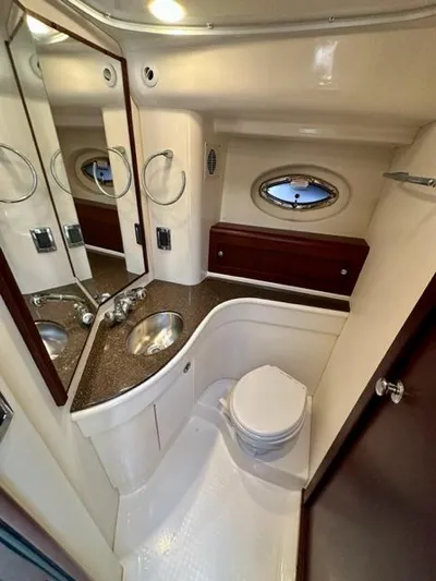 Dolce Far Niente Yacht Photos Pics 2013 Meridian 441 Sedan yacht bathroom with modern fixtures and porthole window.
