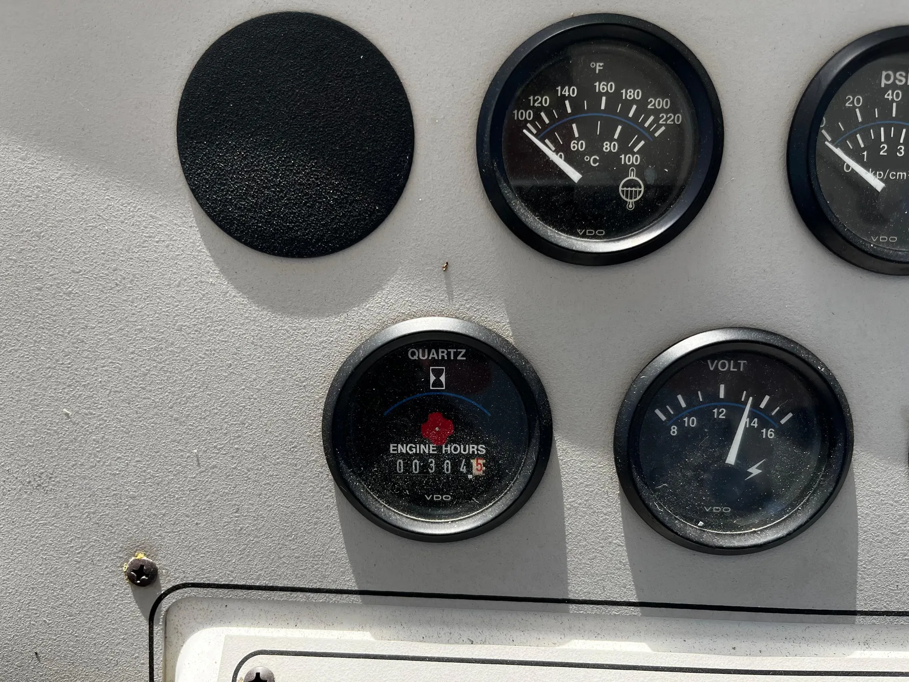 Instrument panel of a 1996 Carver 325 Aft Cabin boat showing gauges and engine hours.