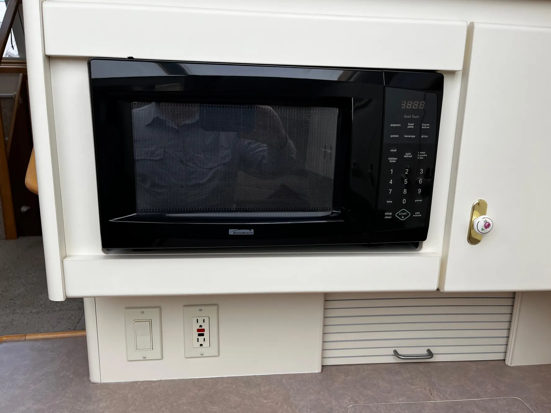 Built-in microwave in 1996 Carver 325 Aft Cabin yacht kitchen area.