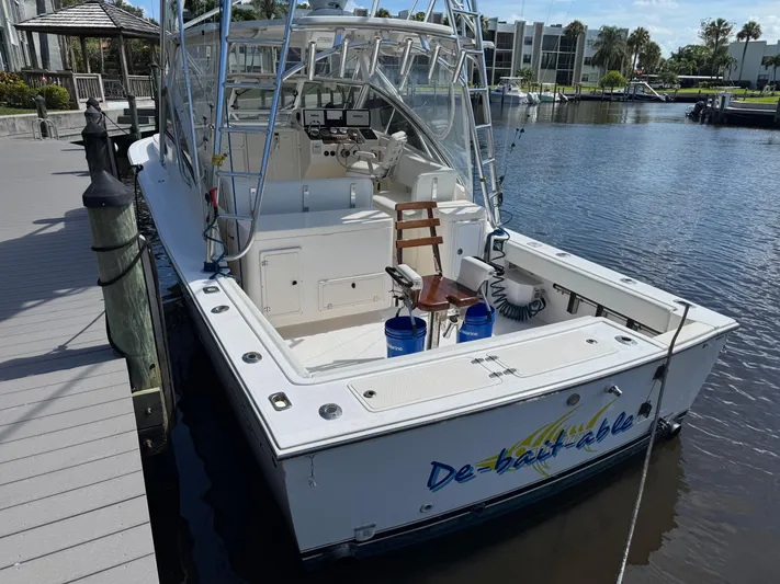 Debaitable Yacht Photos Pics 2004 Albemarle 320 Express Fisherman boat docked at marina, rear view.