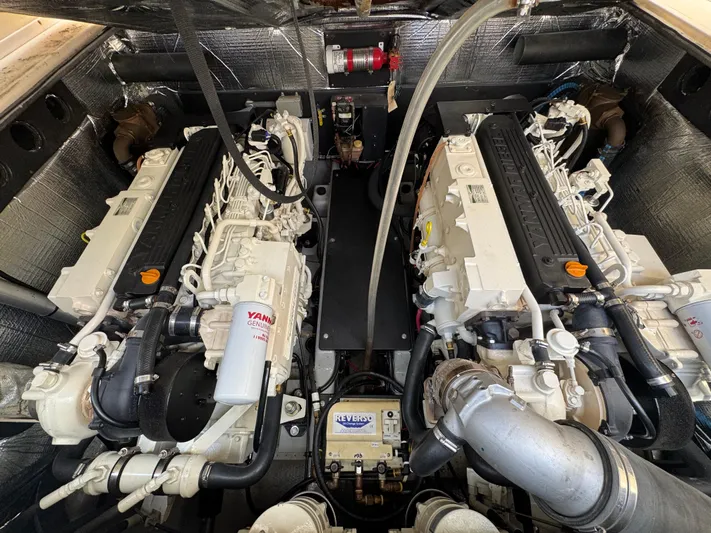 Debaitable Yacht Photos Pics Engine compartment of a 2004 Albemarle 320 Express Fisherman boat, featuring dual Yanmar engines.