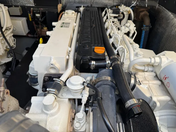 Debaitable Yacht Photos Pics Engine compartment of a 2004 Albemarle 320 Express Fisherman boat, showcasing detailed components.