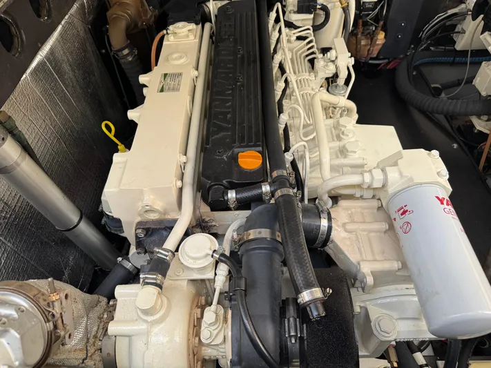 Debaitable Yacht Photos Pics Engine of a 2004 Albemarle 320 Express Fisherman boat, showcasing detailed components.