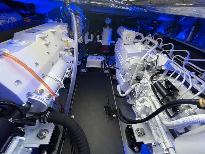 Debaitable Yacht Photos Pics Engine room of a 2004 Albemarle 320 Express Fisherman boat, showcasing dual engines.