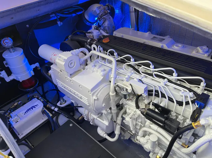 Debaitable Yacht Photos Pics Engine compartment of a 2004 Albemarle 320 Express Fisherman, showcasing detailed mechanical components.