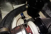 Engine compartment of a 2017 Leopard 43 Powercat with visible components and hoses.