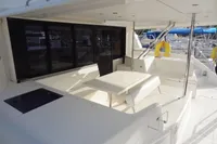2017 Leopard 43 Powercat yacht with spacious outdoor seating area and dining table.