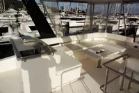 2017 Leopard 43 Powercat yacht interior with white seating and marina view.