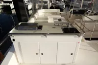 2017 Leopard 43 Powercat yacht with outdoor kitchen and seating area.