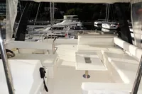 2017 Leopard 43 Powercat yacht interior with spacious seating and marina view.
