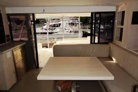 Interior of 2017 Leopard 43 Powercat with marina view through sliding doors.