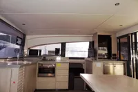 Interior of 2017 Leopard 43 Powercat kitchen with modern appliances and ample counter space.