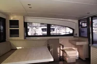 Interior of 2017 Leopard 43 Powercat yacht with dining area and large windows.