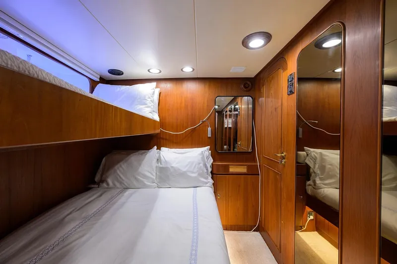 Aventurer Yacht Photos Pics Luxurious 1986 Jongert 85 yacht cabin with wooden interior and cozy bunk beds.