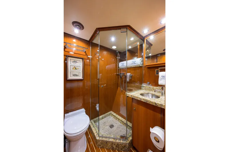 Aventurer Yacht Photos Pics Luxurious bathroom in 1986 Jongert 85 yacht with glass shower and granite countertop.