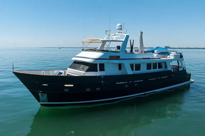 Aventurer Yacht Photos Pics 1986 Jongert 85 yacht on calm water under clear blue sky.