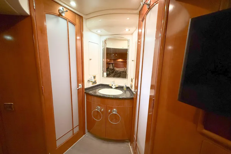 Over And Out Yacht Photos Pics Luxurious bathroom interior of 2001 Carver 570 Voyager Pilothouse yacht with wood finishes.