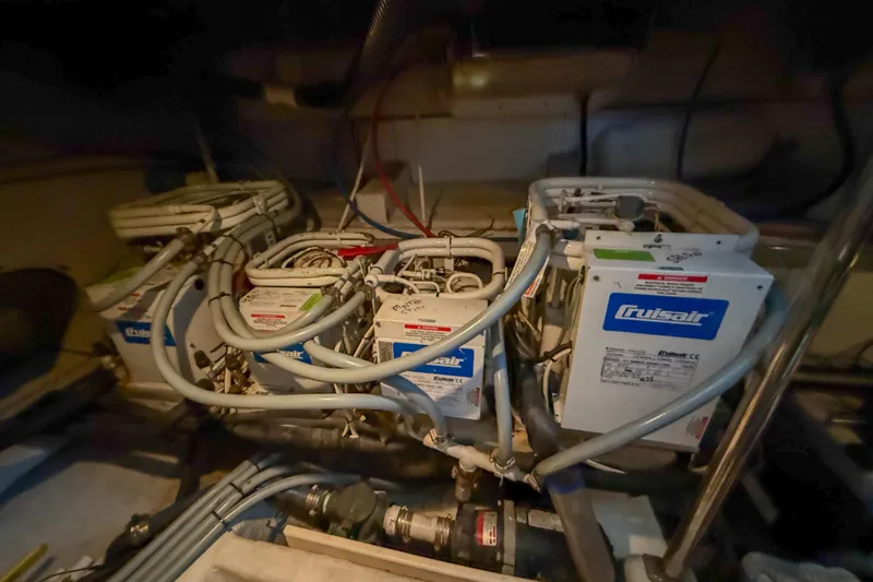 Over And Out Yacht Photos Pics Engine room of 2001 Carver 570 Voyager Pilothouse with Cruisair systems.