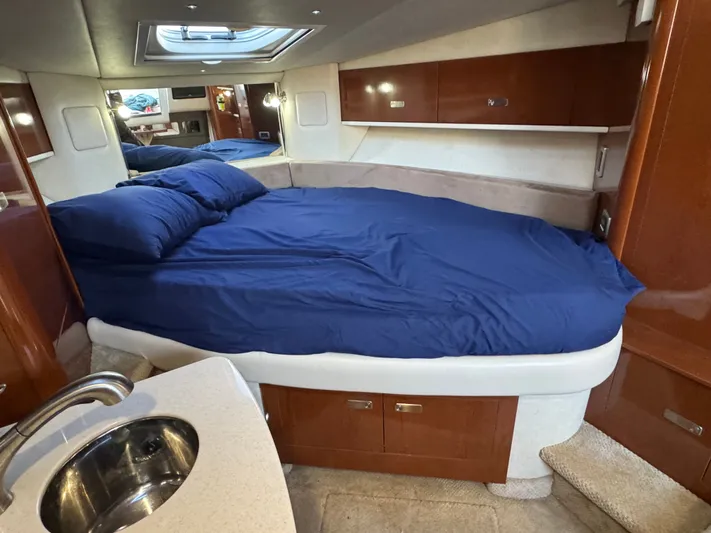 Pura Vida Yacht Photos Pics Interior of 2011 Sea Ray 330 Sundancer with bed and sink.