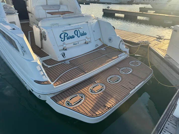 Pura Vida Yacht Photos Pics Sea Ray 330 Sundancer 2011 at dock with wooden deck.