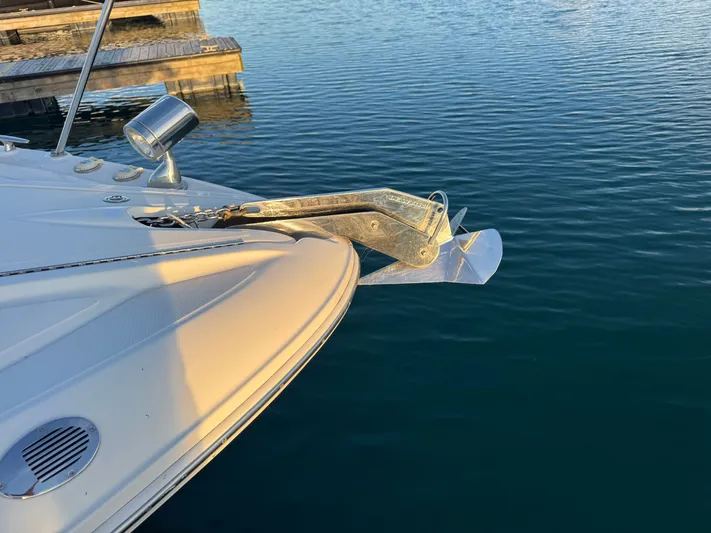Pura Vida Yacht Photos Pics Bow of a 2011 Sea Ray 330 Sundancer with anchor in water.
