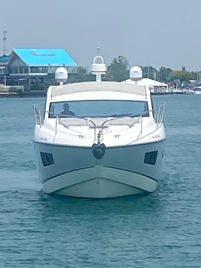 Work Hard, Play Hard Yacht Photos Pics 2013 Sunseeker Portofino 40 yacht on water, front view.