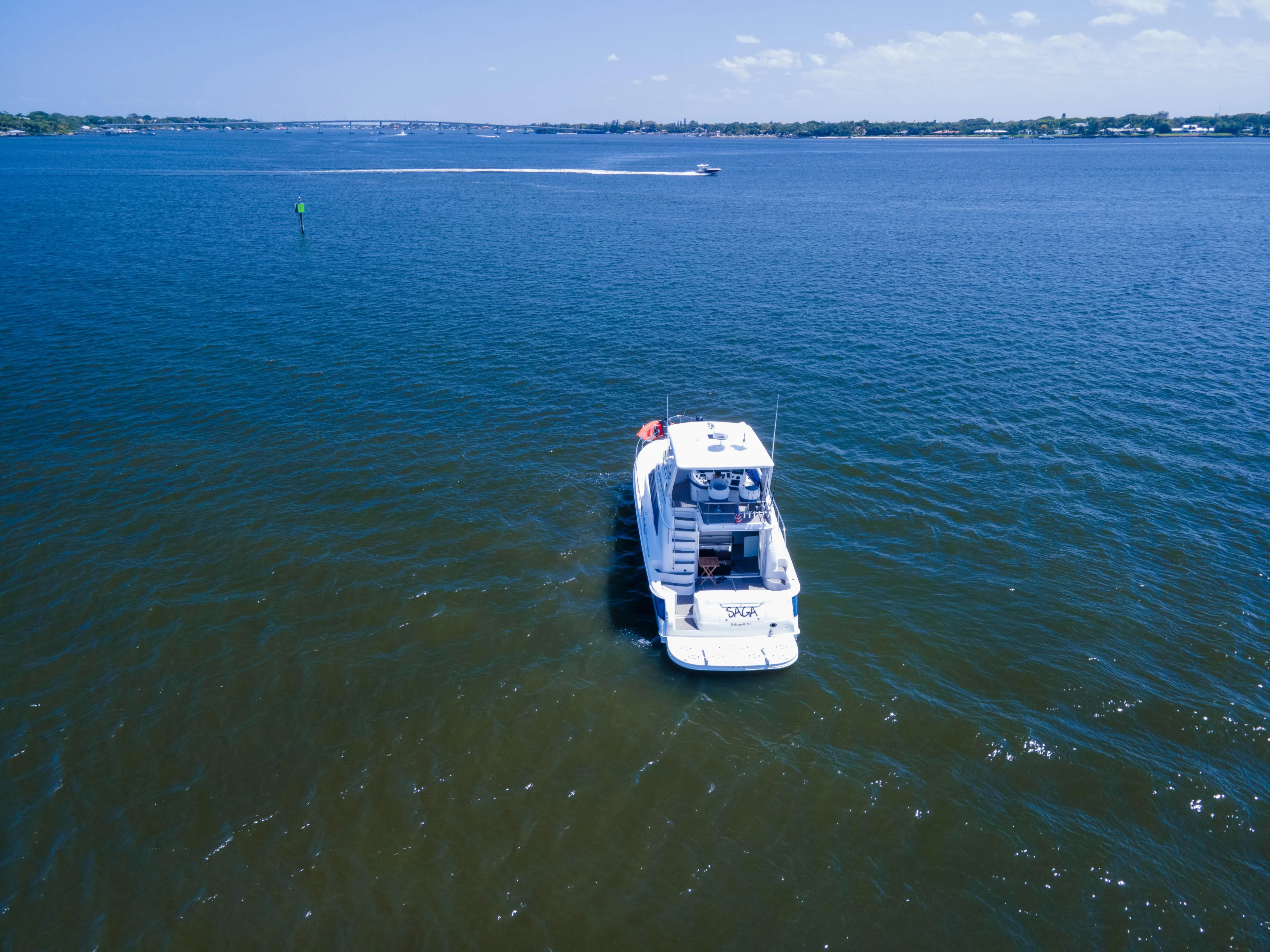 Saga Yacht Photos Pics Aerial view of 1999 Sea Ray 480 Sedan Bridge yacht on open water.