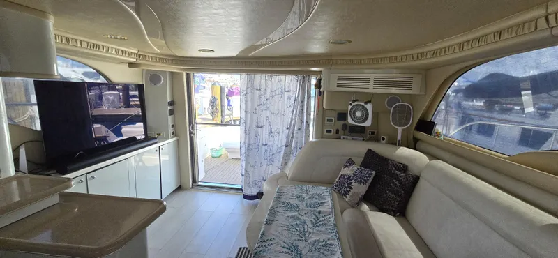 Saga Yacht Photos Pics Luxurious interior of a 1999 Sea Ray 480 Sedan Bridge yacht with elegant furnishings.