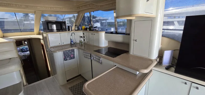 Saga Yacht Photos Pics Interior of 1999 Sea Ray 480 Sedan Bridge yacht with modern kitchen amenities.