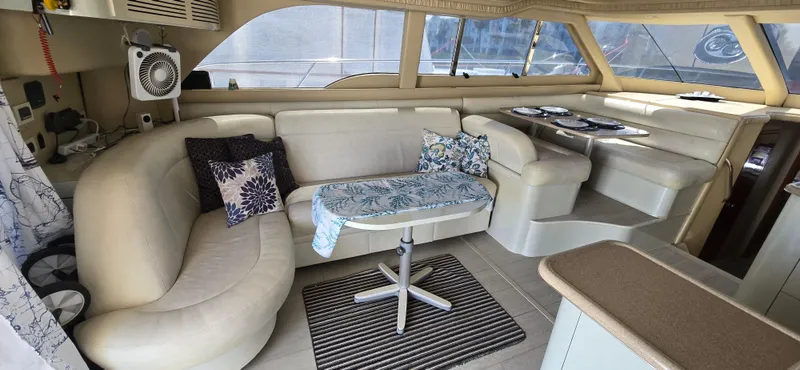 Saga Yacht Photos Pics Luxurious interior of a 1999 Sea Ray 480 Sedan Bridge yacht with elegant seating.