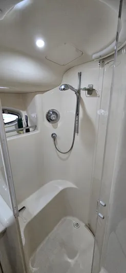Saga Yacht Photos Pics 1999 Sea Ray 480 Sedan Bridge shower with modern fixtures and sleek design.