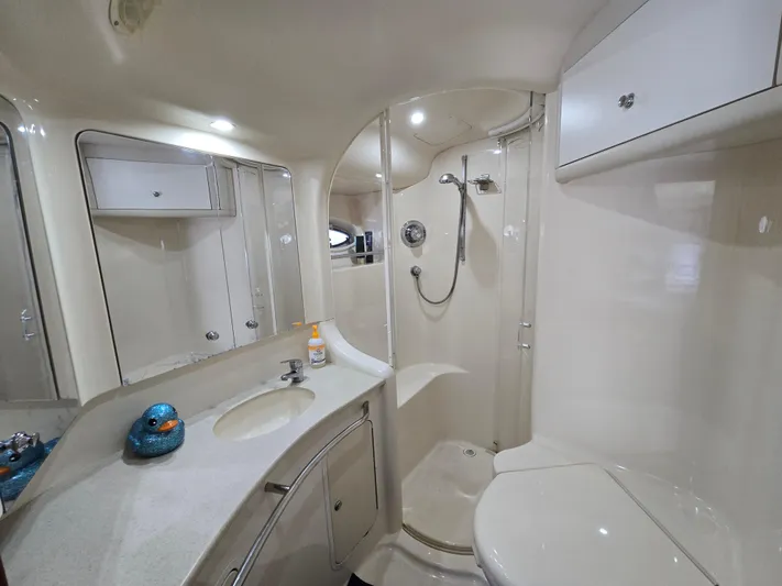 Saga Yacht Photos Pics Luxurious bathroom in 1999 Sea Ray 480 Sedan Bridge yacht, featuring modern fixtures and elegant design.