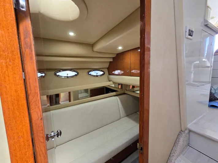 Saga Yacht Photos Pics Interior cabin of 1999 Sea Ray 480 Sedan Bridge yacht with porthole windows.