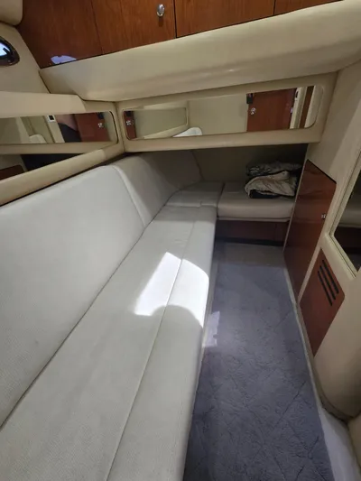 Saga Yacht Photos Pics Interior of 1999 Sea Ray 480 Sedan Bridge with beige seating and wooden cabinetry.
