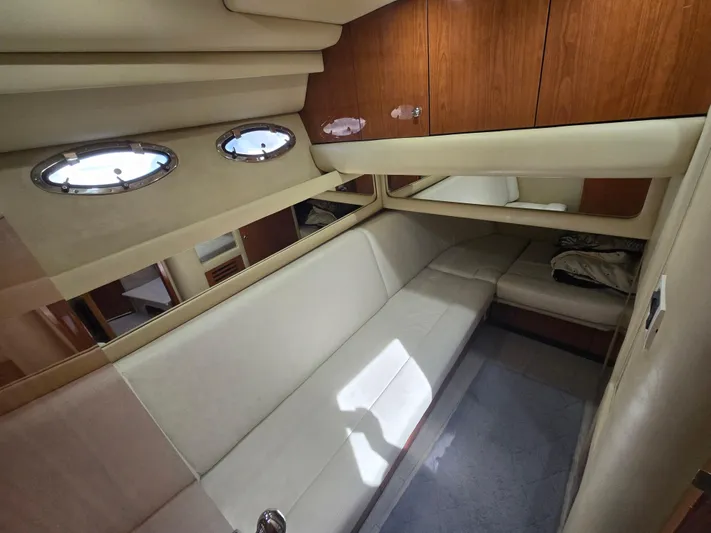 Saga Yacht Photos Pics 1999 Sea Ray 480 Sedan Bridge interior with beige seating and wooden cabinets.