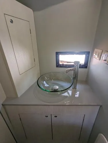  Yacht Photos Pics Modern bathroom sink on 2021 Panamera Yacht PY 100 with glass basin and sleek faucet.