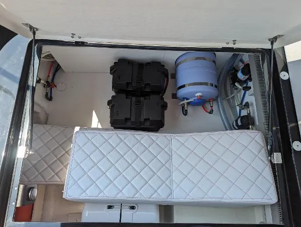  Yacht Photos Pics Interior view of 2021 Panamera Yacht PY 100 storage compartment with quilted seating and equipment.