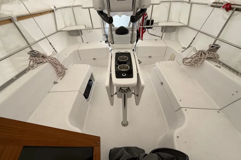  Yacht Photos Pics 2023 Catalina 315 sailboat cockpit with seating, ropes, and steering console.
