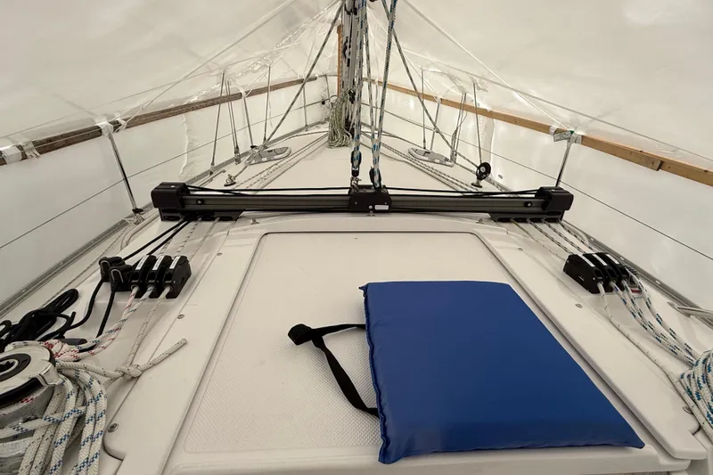  Yacht Photos Pics 2023 Catalina 315 sailboat deck with rigging and blue cushion.