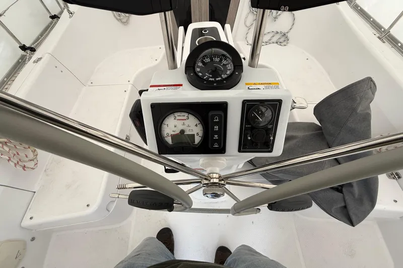  Yacht Photos Pics Cockpit view of 2023 Catalina 315 sailboat with navigation instruments and steering wheel.