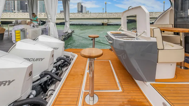 Custom Order Your 415 Today! Yacht Photos Pics Luxury Hanover 415 yacht deck with Mercury engines, sleek design, and waterfront view, 2025 model.