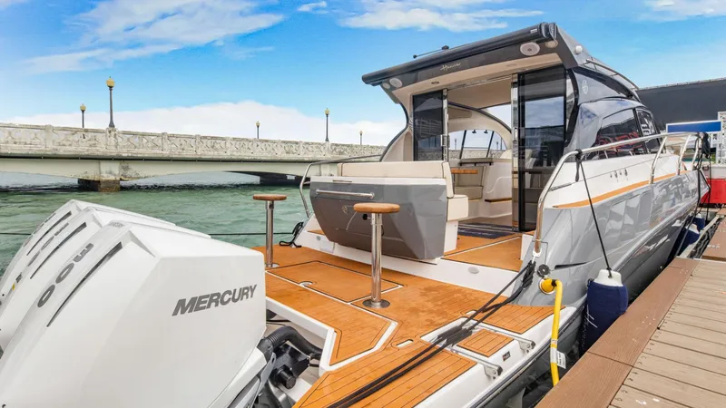 Custom Order Your 415 Today! Yacht Photos Pics Luxury Hanover 415 yacht docked, showcasing sleek design and powerful Mercury engines, 2025 model.